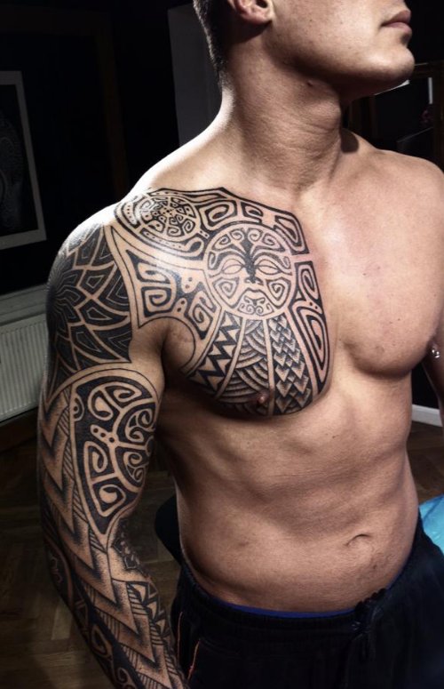 Maori Black Ink Tribal Chest And Sleeve Tattoo