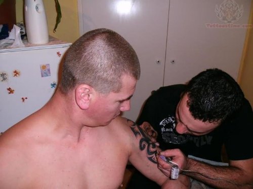 Tribal Black Ink Tattoo In Process
