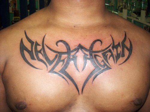 Awesome Black Ink Tribal Tattoo On Man Chest