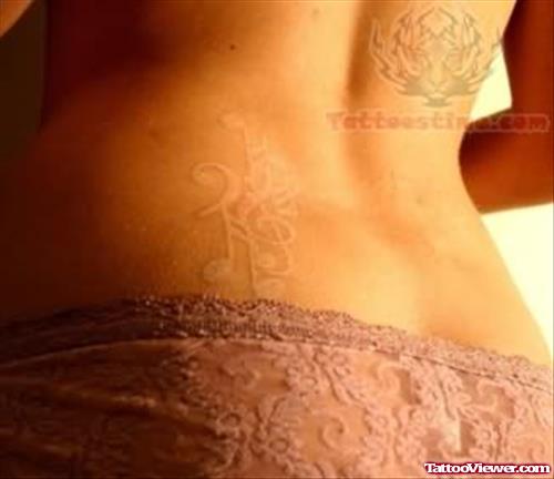White Ink Lower Back Tattoo