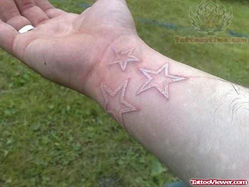 Tattoo of Stars With White Ink