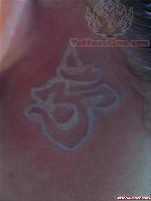 White Om Tattoo Behind Ear