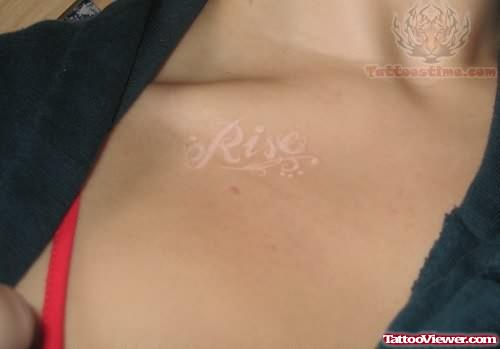 White Ink Rise Tattoo On Chest
