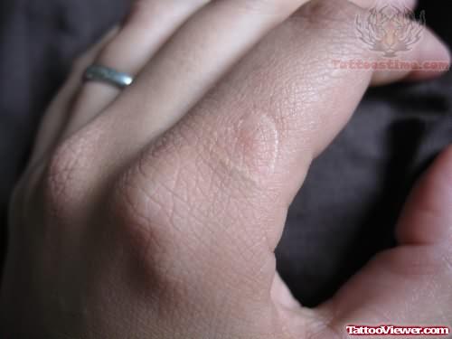 White Ink Tattoo On Finger