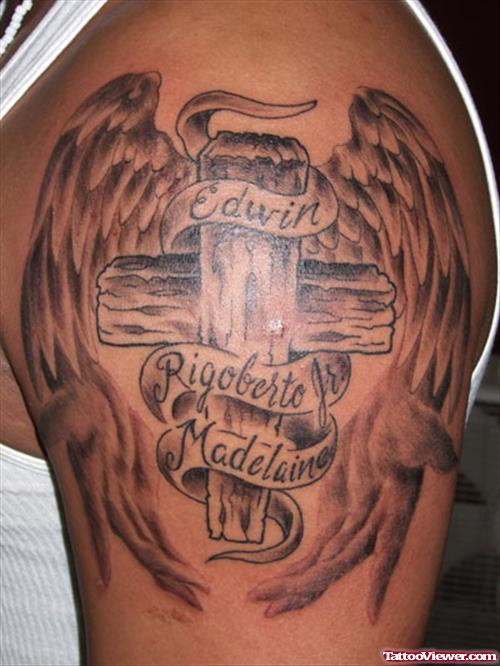 Grey Ink Cross And Wings Tattoos On Shoulder