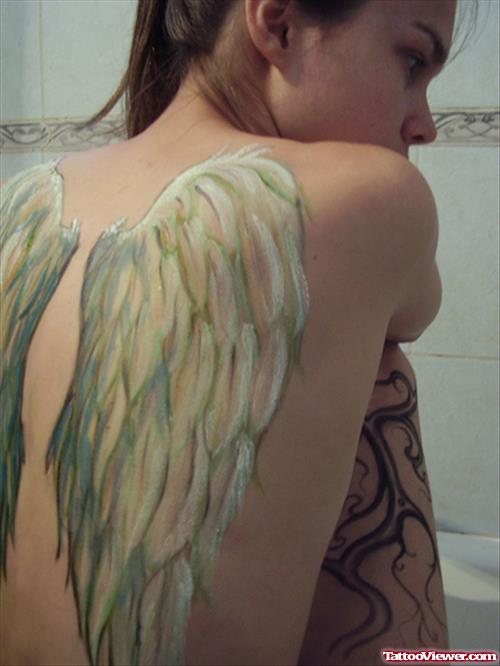Color Ink Wings Tattoo On Girl Back