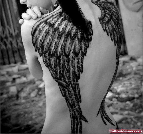 Attractive Grey Ink Angel Wings Tattoo On Back