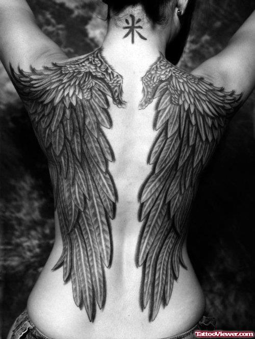 Attractive Dark Ink Wings Tattoos On Back