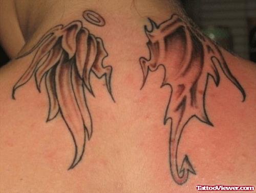 Grey Ink Wings Tattoo On Upperback