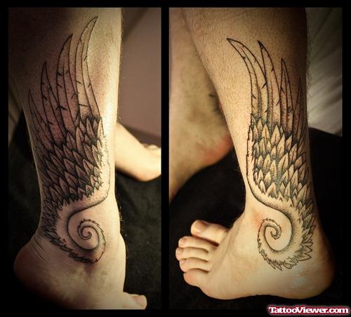 Grey Ink Angel Wing Tattoo On Leg