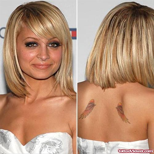 Celebrity With Color Ink Wings Tattoos On Back