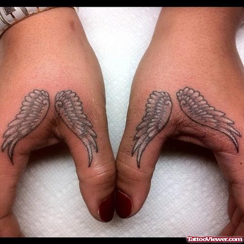 Amazing Grey Ink Small Wings Tattoos On Hands