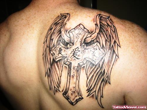 Grey Ink Cross And Wings Tattoos On Back Shoulder