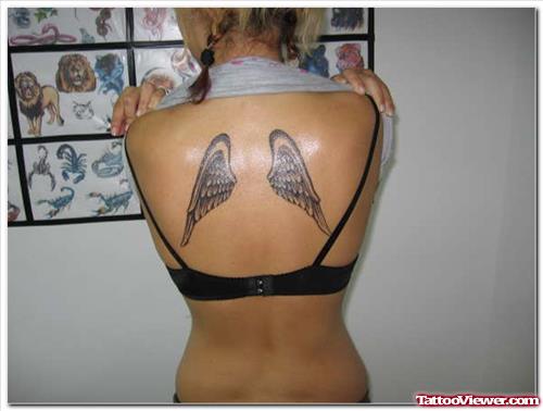 Grey Ink Wings Tattoos On Back For Girls