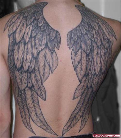 Grey Ink Feather Wings Tattoo On Back