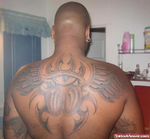 Grey Ink Eye And Wings Tattoos On Back