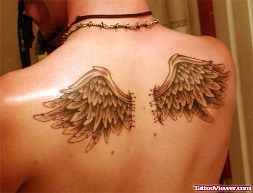 Cool Grey Ink Wings Tattoos On Upperback