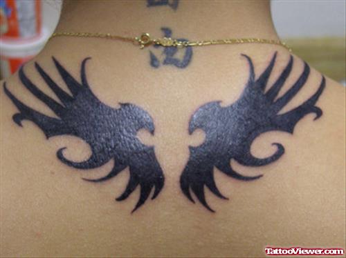 Black Tribal Wings Tattoos On Upperback