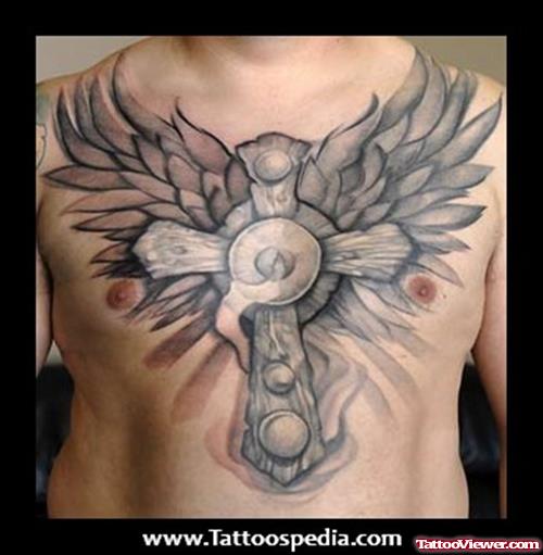 Grey Ink Cross And Wings Tattoos On Man Chest