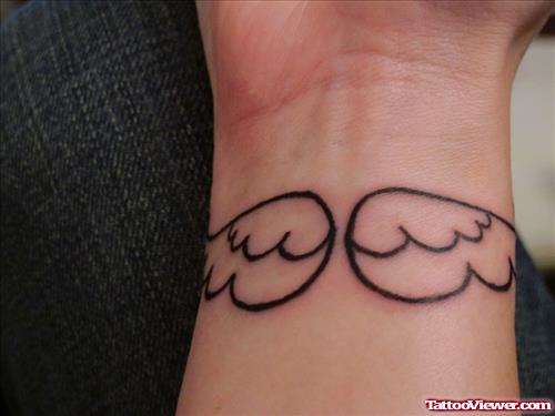 Outline Angel Wings Tattoo On Wrist