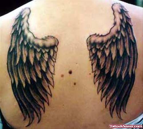 Amazing Grey Ink Wings Tattoos On Back