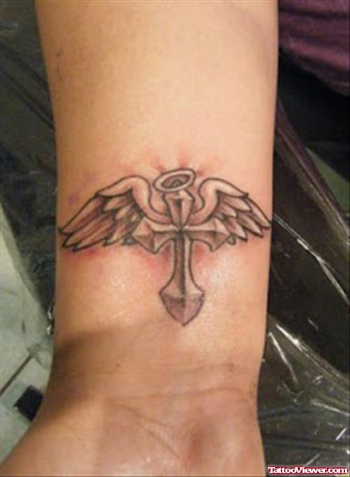 Superior Grey Ink Cross And Wings Tattoo