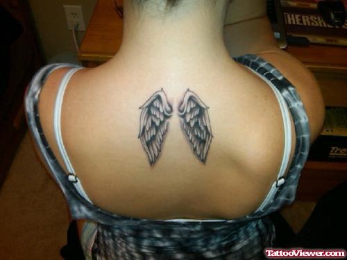 Small Wings Tattoo On Upperback
