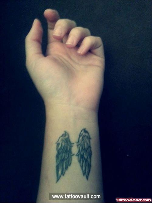 Wings Tattoos On Left Forearm