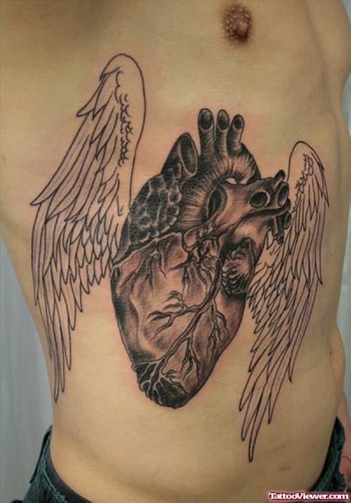 Human Heart With Wings Tattoo