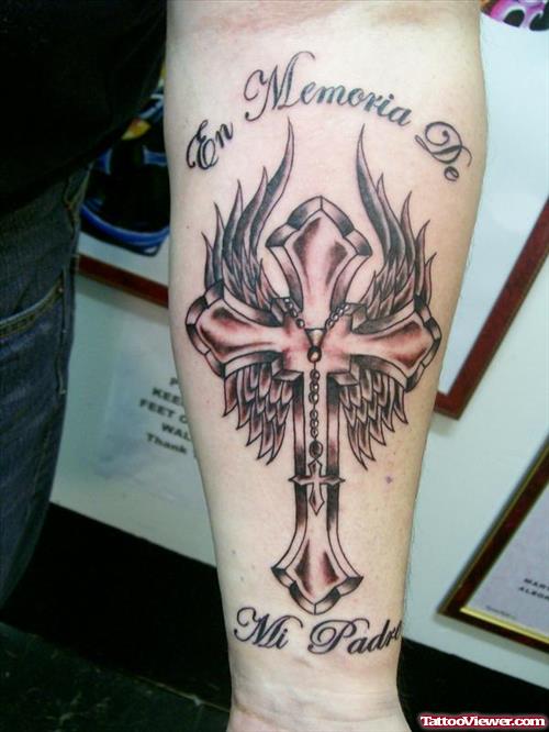 Grey Ink Winged Cross Tattoo On Left Arm