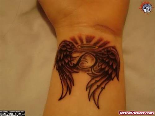 Grey Ink Angel Wings Tattoos On Left Wrist