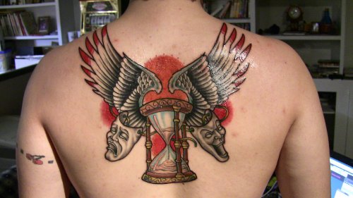 Amazing Grey Ink Winged Hourglass Tattoo On Back