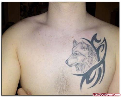 Black Tribal And Wolf Head Tattoo On Chest