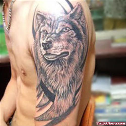 Tribal And Wolf Head Tattoo On Left Sleeve