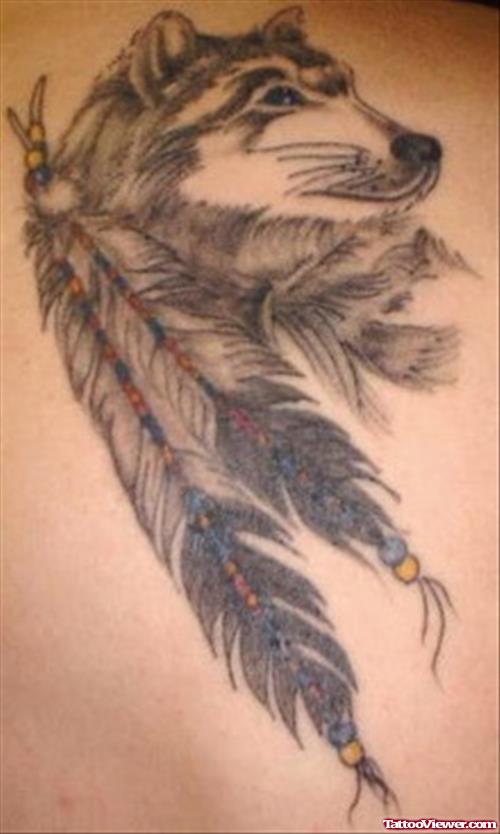 Grey Ink Feathers and Wolf Head Tattoo