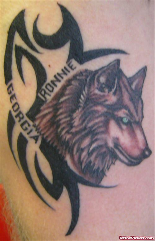 Black Ink Tribal And Wolf Head Tattoo