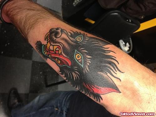 Black and Red Ink Wolf Tattoo on Arm