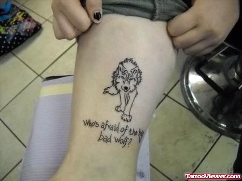 Lettering and Wolf Tattoo On Leg