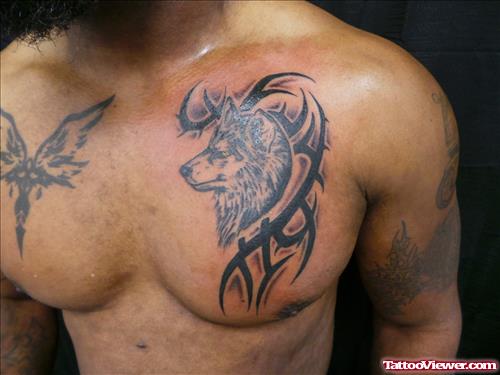 Tribal And Wolf Head Tattoo On Chest