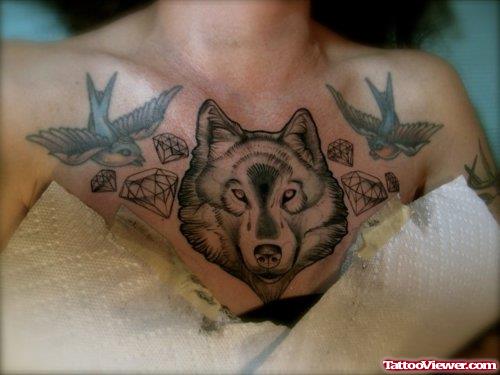 Grey Ink Flying Birds And Wolf Head Tattoo On Man Chest