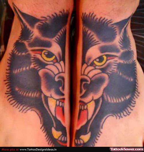 Amazing Black Ink Wolf Head Tattoo On Feet