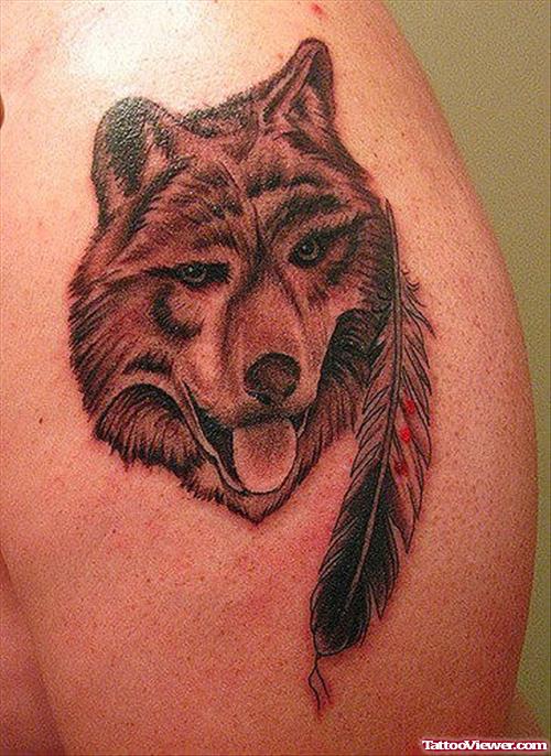 Grey Ink Feather and Wolf Head Tattoo On Shoulder