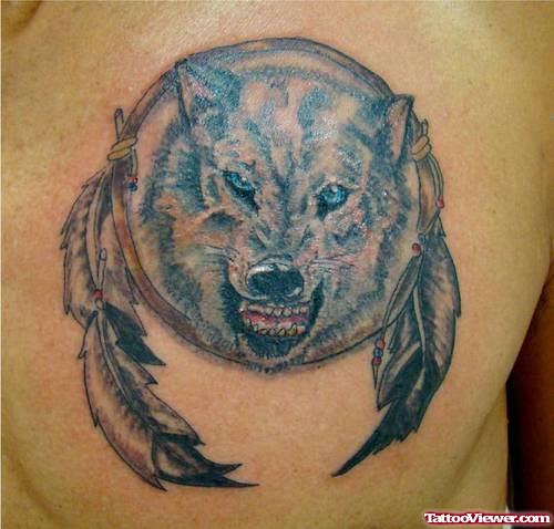 Awesome Grey Ink Feathers And Wolf Head Tattoo On Chest