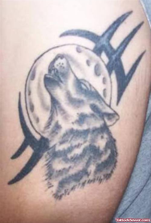 Tribal And Moon With Howling Wolf Tattoo