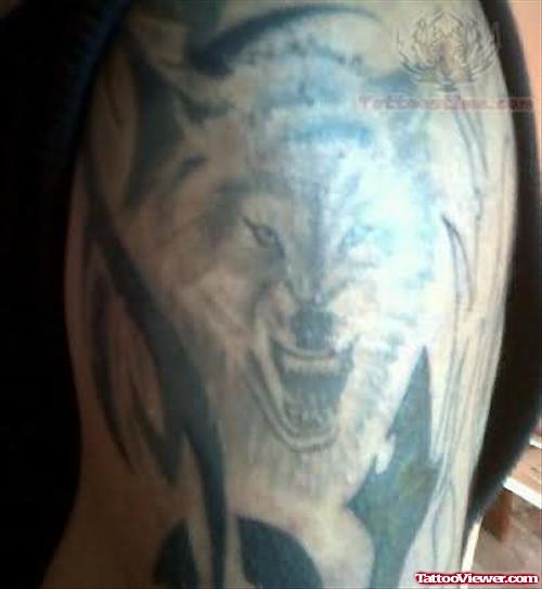Tribal And Wolf Grey Ink Tattoo On Half Sleeve