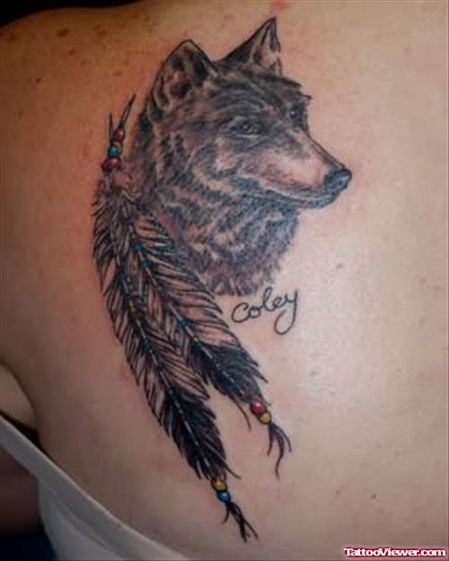 Wolf Head With Feathers Tattoo