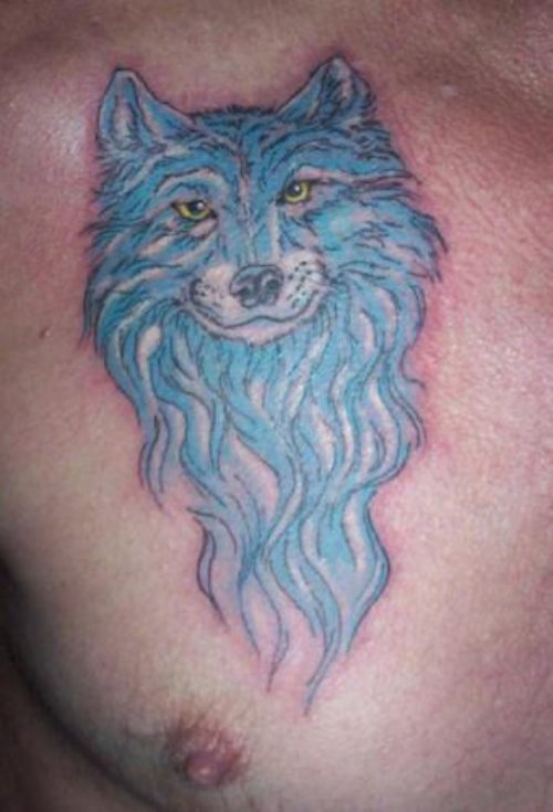 Blue Ink Wolf Tattoo On Man Chest