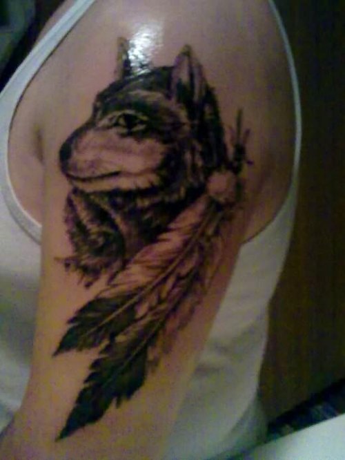 Grey Ink Feathers And Wolf Head Tattoo On Left Half Sleeve