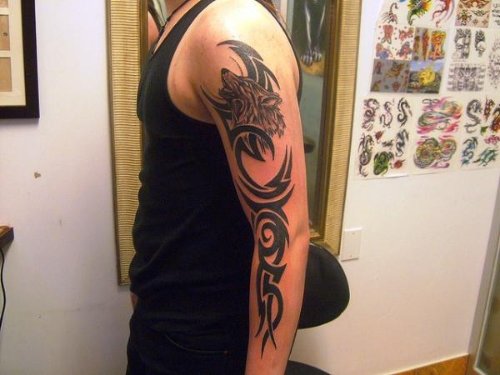 Tribal And Wolf Tattoo On Left Sleeve