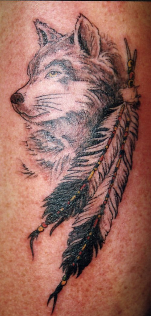 Feathers and Wolf Head Tattoo